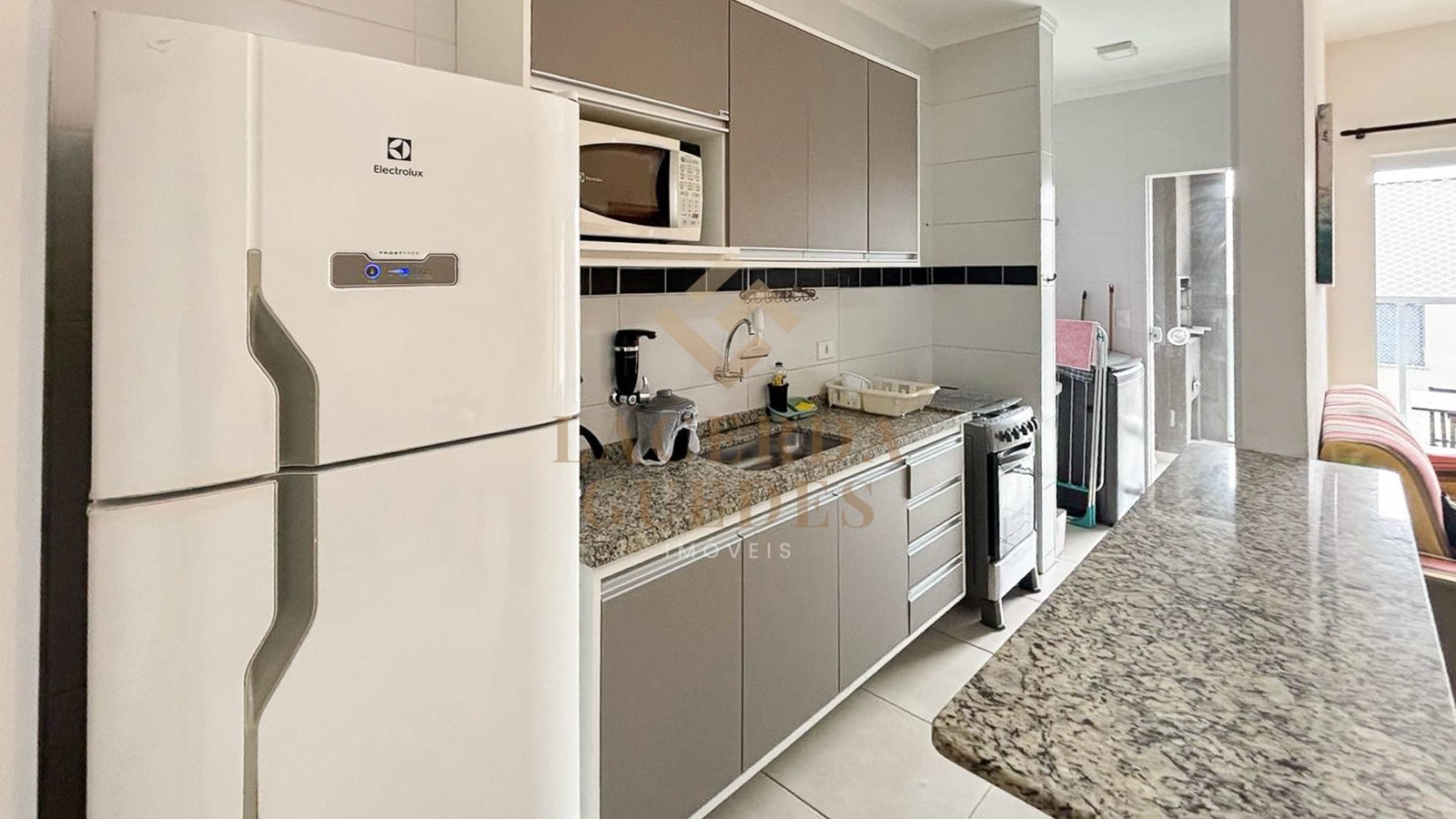 apartamento-itagua-75m2-varanda-gourmet-5 Sala de estar do apartamento no Itaguá