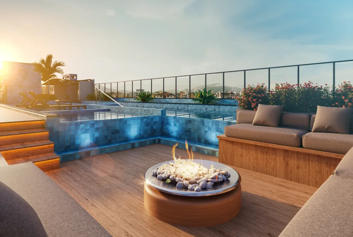 Área de convivência com fire pit no rooftop do Olive