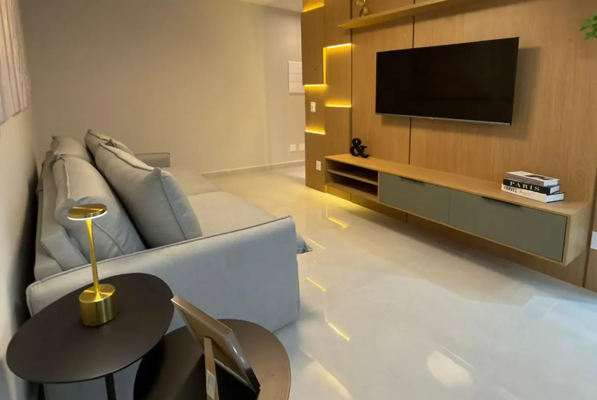 Sala com TV do apartamento de 74 m² no Residencial Vie Saine